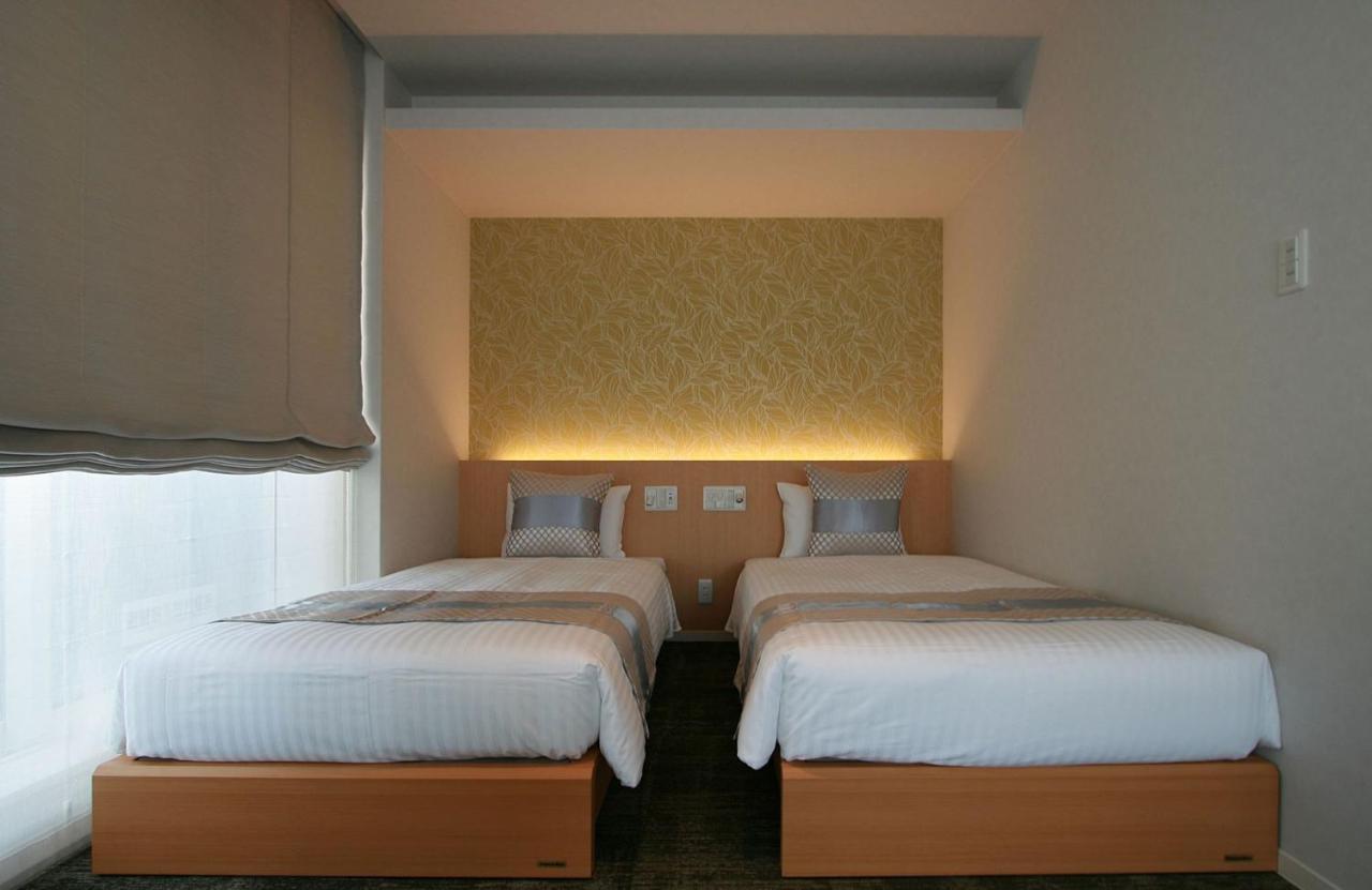 Апарт отель Grand Base Okayama Ekimae Экстерьер фото